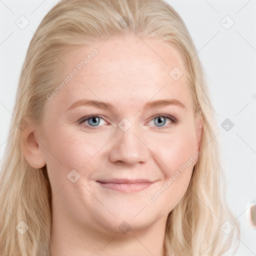 Joyful white young-adult female with long  blond hair and blue eyes