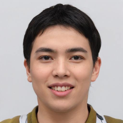 Joyful asian young-adult male with short  black hair and brown eyes