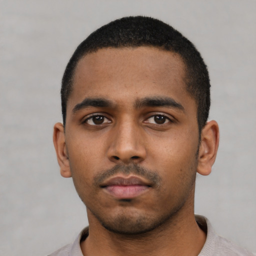 Neutral black young-adult male with short  black hair and brown eyes