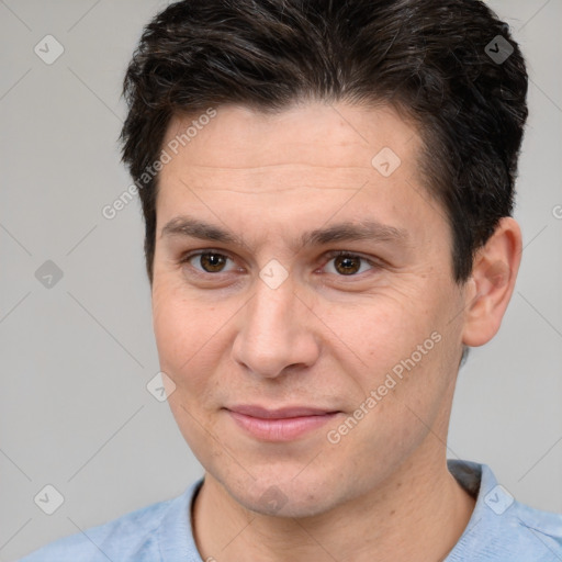 Joyful white adult male with short  brown hair and brown eyes