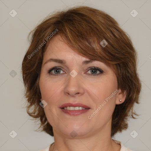 Joyful white adult female with medium  brown hair and brown eyes