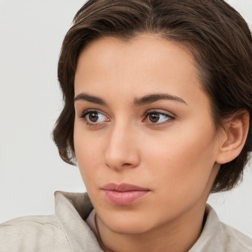 Neutral white young-adult female with medium  brown hair and brown eyes