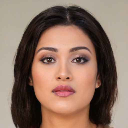 Neutral asian young-adult female with medium  brown hair and brown eyes