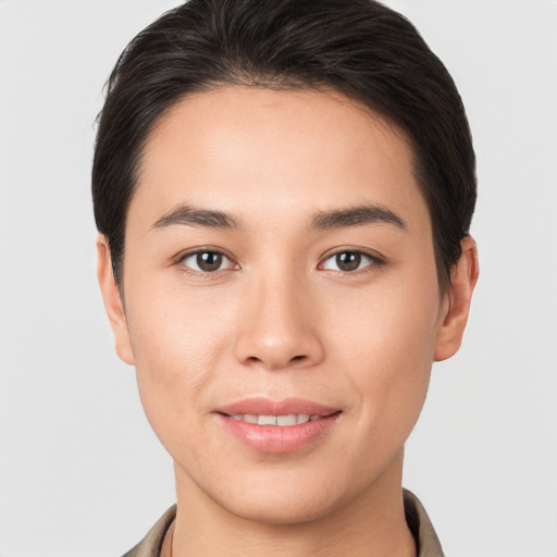 Joyful white young-adult female with short  brown hair and brown eyes