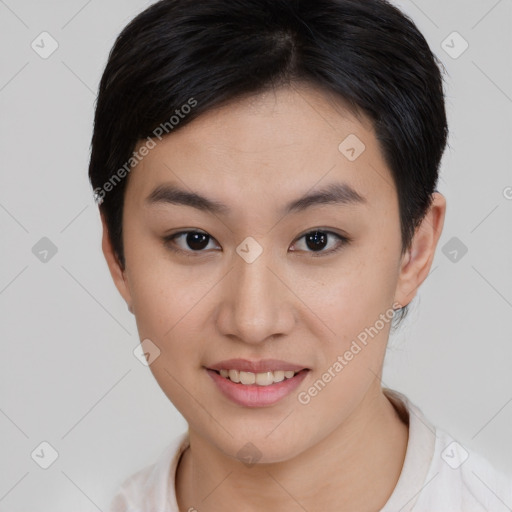 Joyful asian young-adult female with short  brown hair and brown eyes