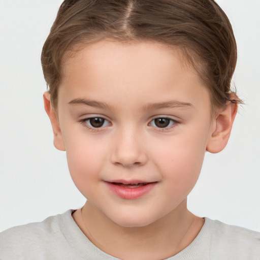 Joyful white child female with short  brown hair and brown eyes