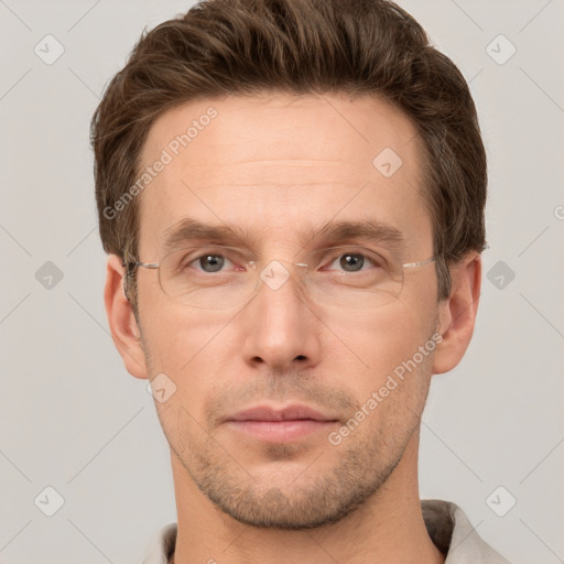 Joyful white adult male with short  brown hair and grey eyes