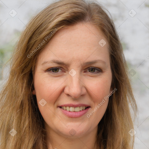 Joyful white adult female with long  brown hair and brown eyes