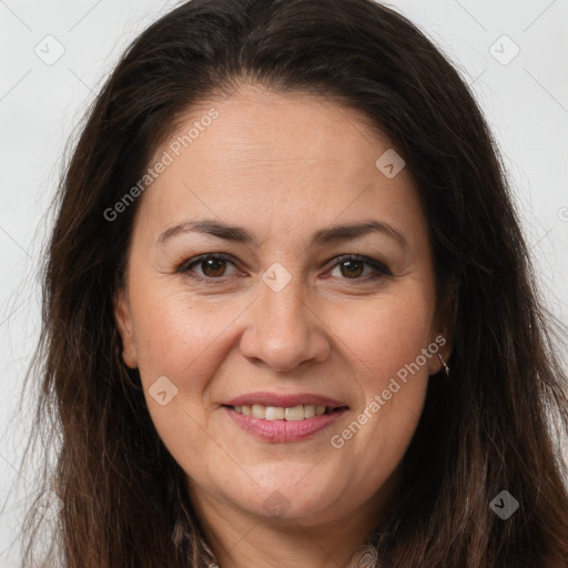 Joyful white adult female with long  brown hair and brown eyes