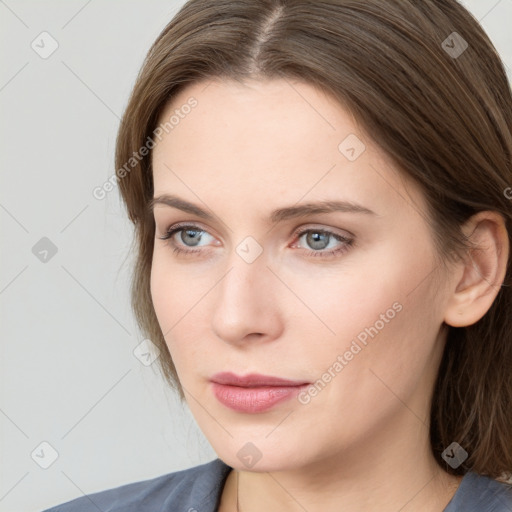 Neutral white young-adult female with medium  brown hair and grey eyes