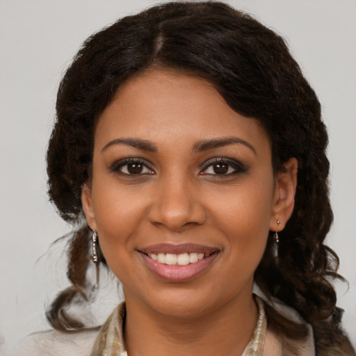 Joyful black young-adult female with medium  brown hair and brown eyes