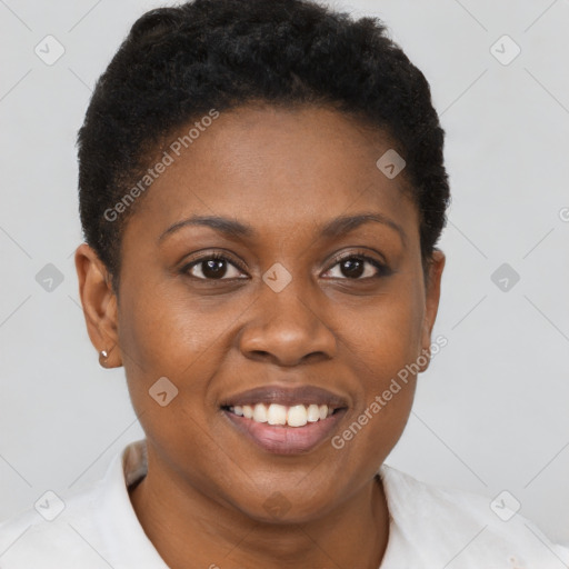 Joyful black young-adult female with short  brown hair and brown eyes