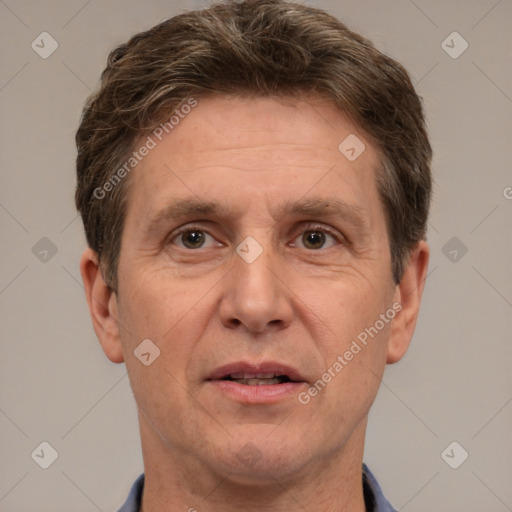 Joyful white adult male with short  brown hair and grey eyes