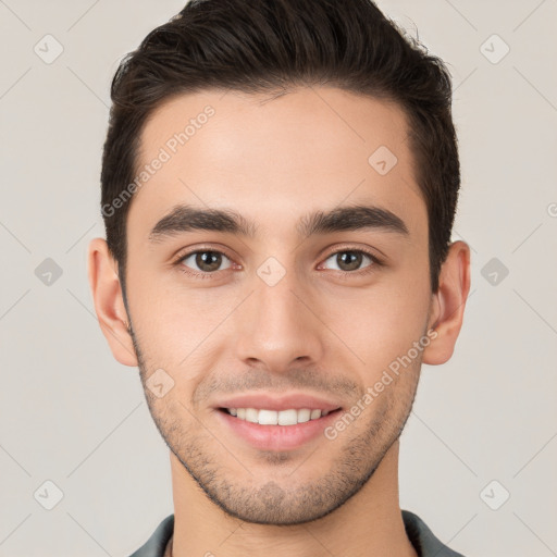 Joyful white young-adult male with short  brown hair and brown eyes