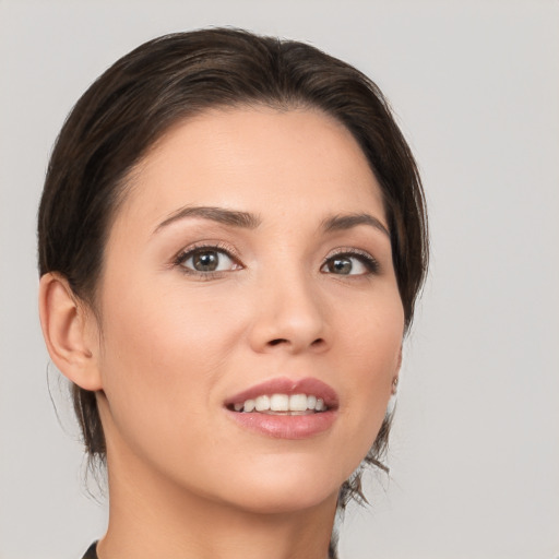 Joyful white young-adult female with medium  brown hair and brown eyes