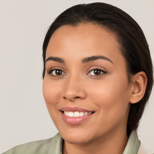 Joyful white young-adult female with medium  brown hair and brown eyes