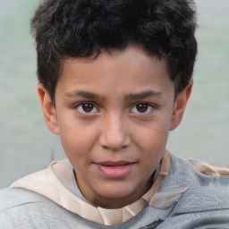 Joyful white child male with short  brown hair and brown eyes