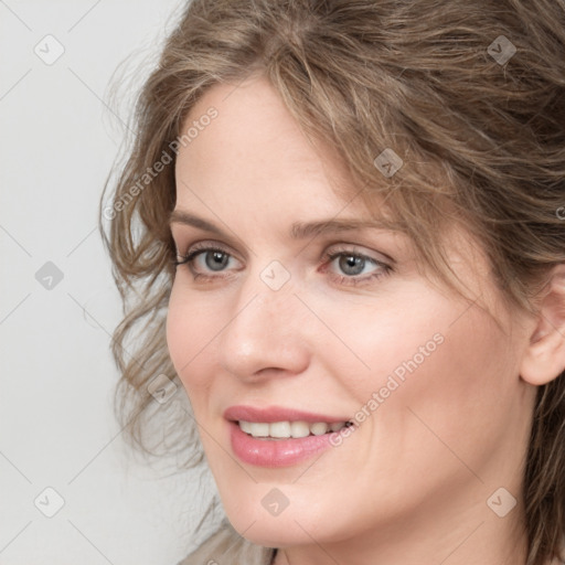 Joyful white young-adult female with medium  brown hair and blue eyes