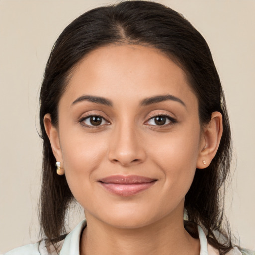 Joyful white young-adult female with medium  brown hair and brown eyes