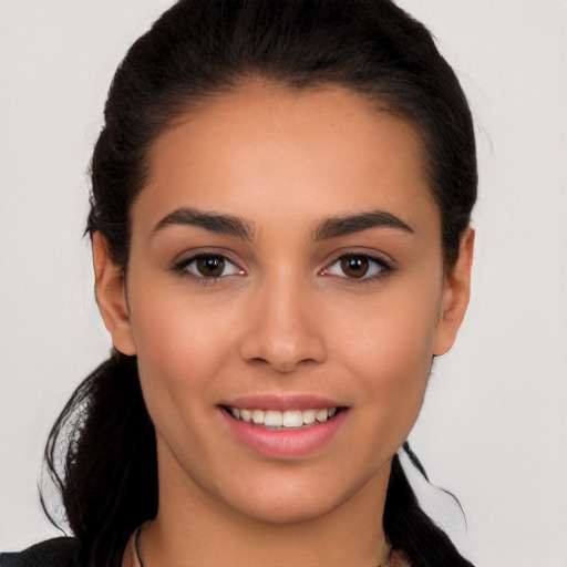 Joyful white young-adult female with medium  brown hair and brown eyes