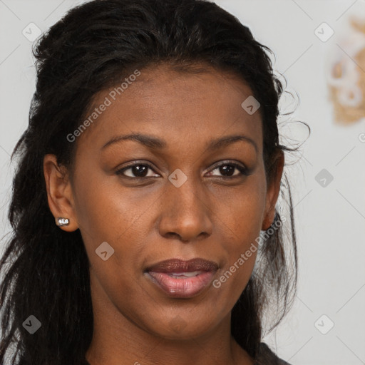 Joyful black young-adult female with long  brown hair and brown eyes