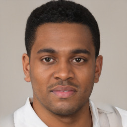 Joyful latino young-adult male with short  brown hair and brown eyes