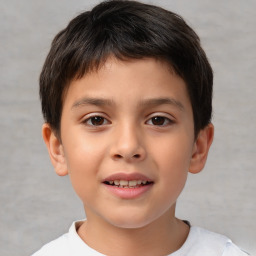 Joyful white child male with short  brown hair and brown eyes