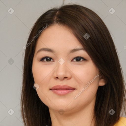 Joyful asian young-adult female with long  brown hair and brown eyes