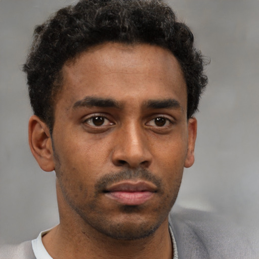 Neutral black young-adult male with short  brown hair and brown eyes
