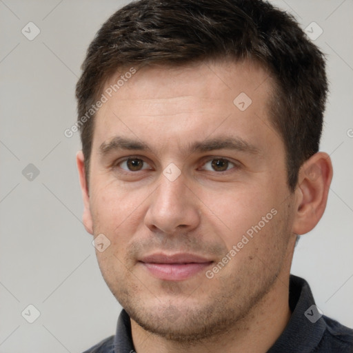 Joyful white adult male with short  brown hair and brown eyes