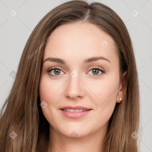 Joyful white young-adult female with long  brown hair and green eyes