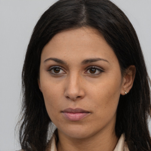 Neutral latino young-adult female with long  brown hair and brown eyes