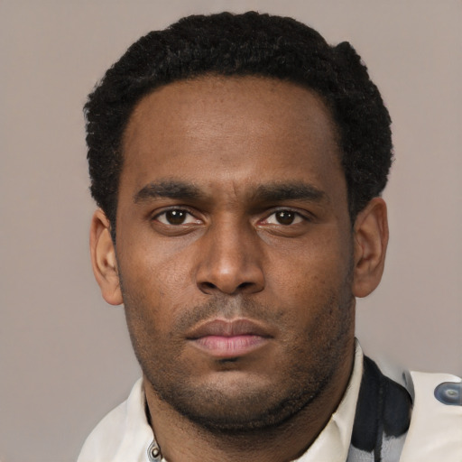 Neutral black young-adult male with short  black hair and brown eyes