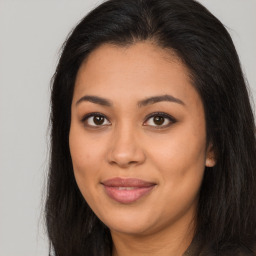 Joyful asian young-adult female with long  brown hair and brown eyes