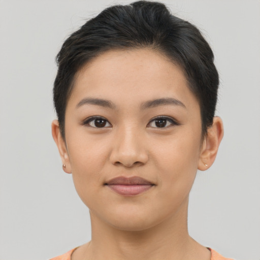 Joyful latino young-adult female with short  brown hair and brown eyes