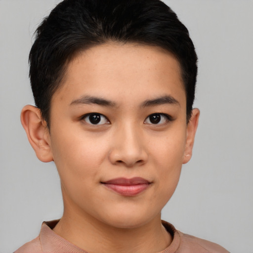 Joyful asian young-adult female with short  brown hair and brown eyes