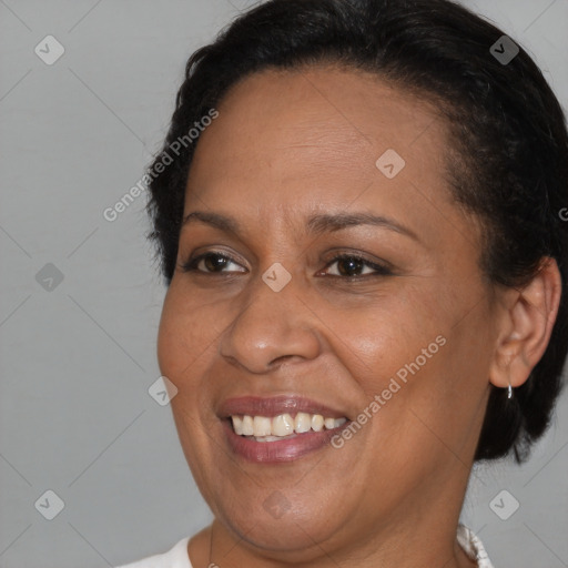 Joyful black adult female with short  brown hair and brown eyes