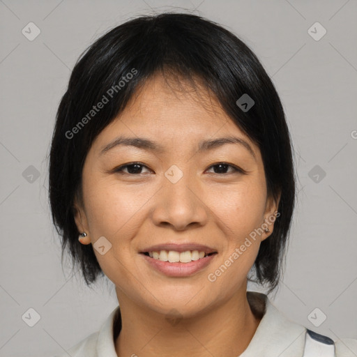 Joyful asian young-adult female with medium  black hair and brown eyes