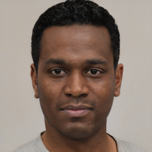 Neutral black young-adult male with short  black hair and brown eyes
