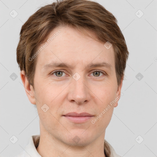 Joyful white adult male with short  brown hair and grey eyes