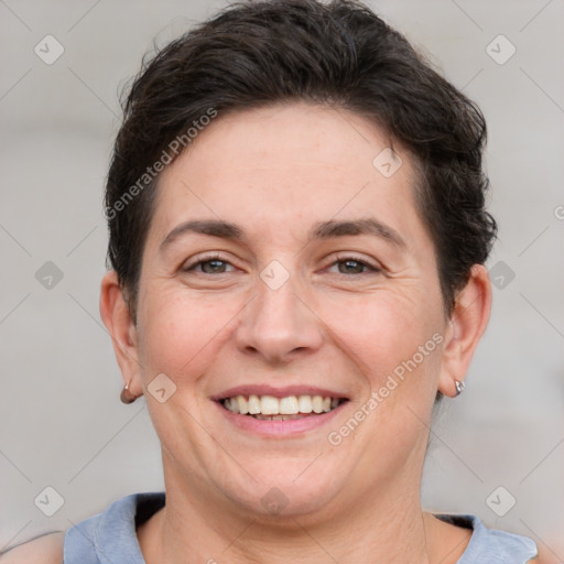 Joyful white adult female with short  brown hair and brown eyes