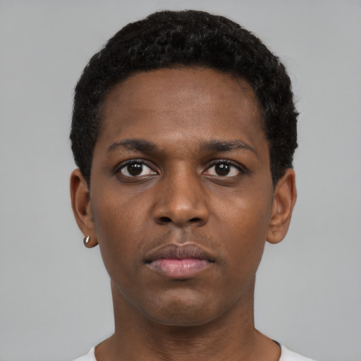 Neutral black young-adult male with short  black hair and brown eyes
