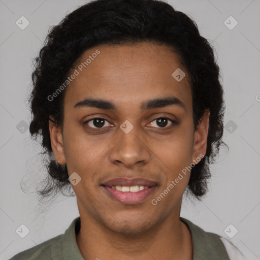 Joyful black young-adult male with short  brown hair and brown eyes