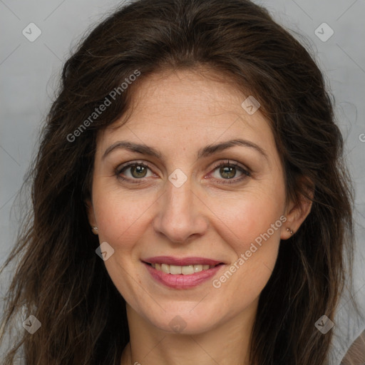 Joyful white adult female with long  brown hair and brown eyes