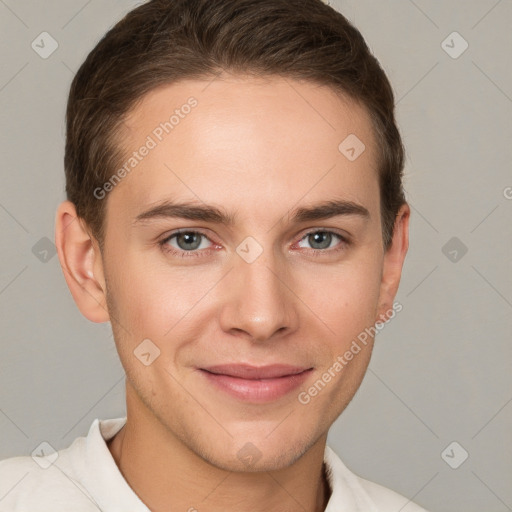 Joyful white young-adult male with short  brown hair and grey eyes