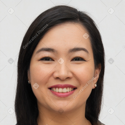 Joyful asian young-adult female with long  brown hair and brown eyes