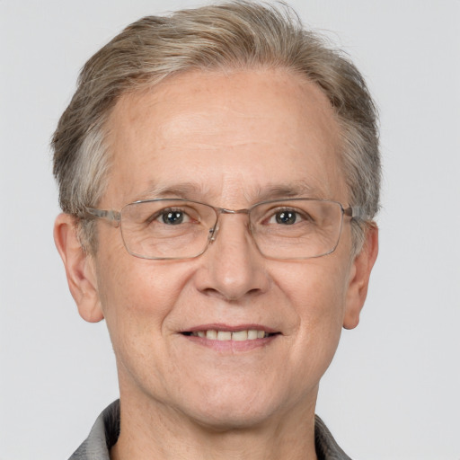 Joyful white middle-aged male with short  gray hair and grey eyes