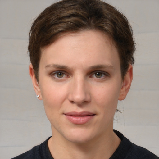 Joyful white young-adult female with short  brown hair and grey eyes