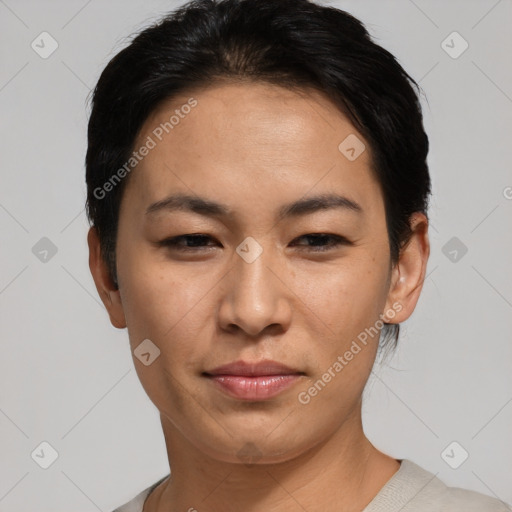 Joyful asian young-adult female with short  black hair and brown eyes