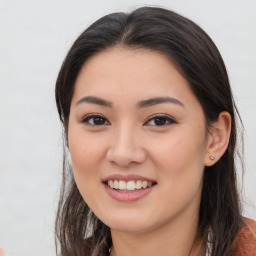 Joyful asian young-adult female with long  brown hair and brown eyes